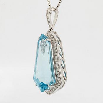 An 18K gold and aquamarine pendant set with round brilliant-cut diamonds.