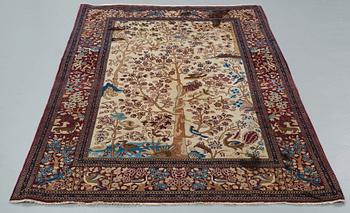 A RUG, a semi-antique Esfahan probably, figural, ca 214,5 x 137,5 cm.