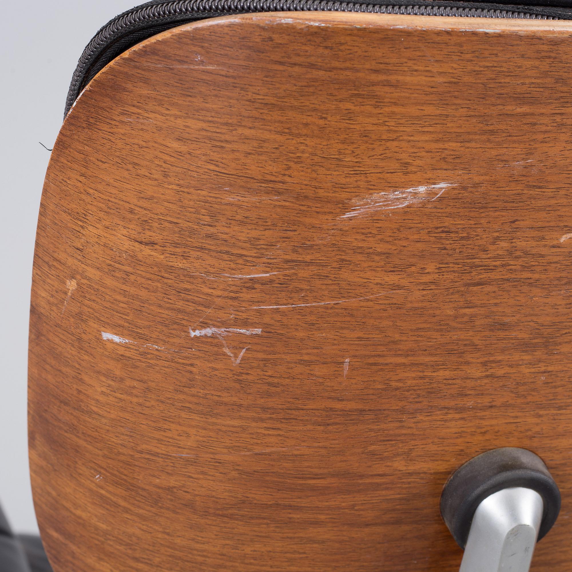 An easy chair and ottoman by Charles & Ray Eames, Herman Miller, USA, produced with licence by Hille, London.