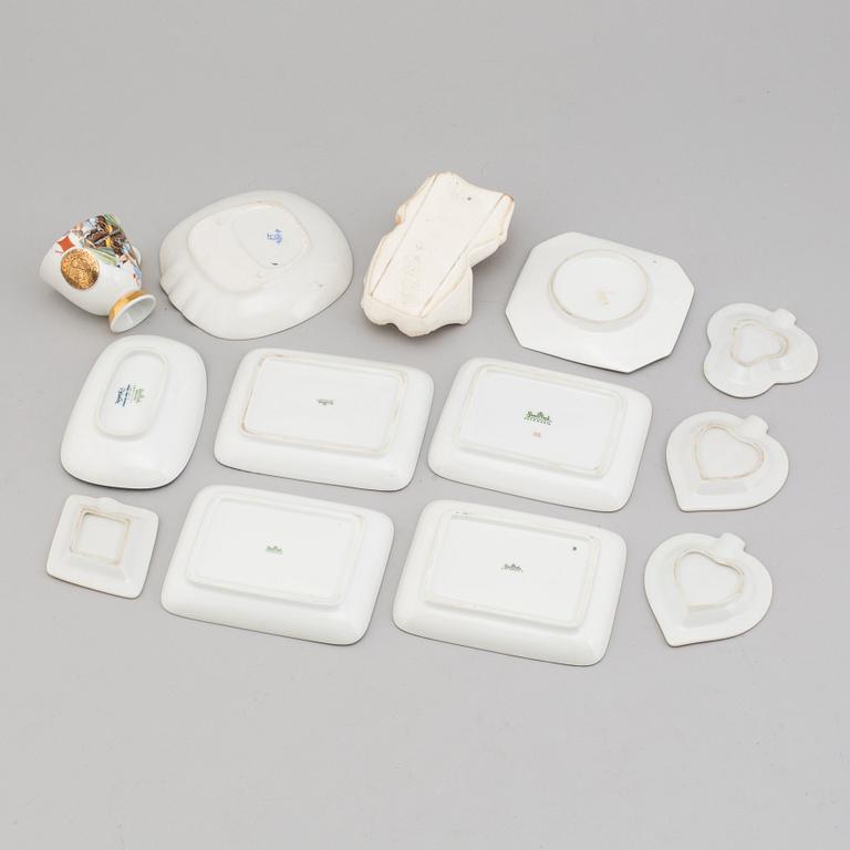 Ashtrays and cup with saucer, porcelain, 12 parts. 20th century.