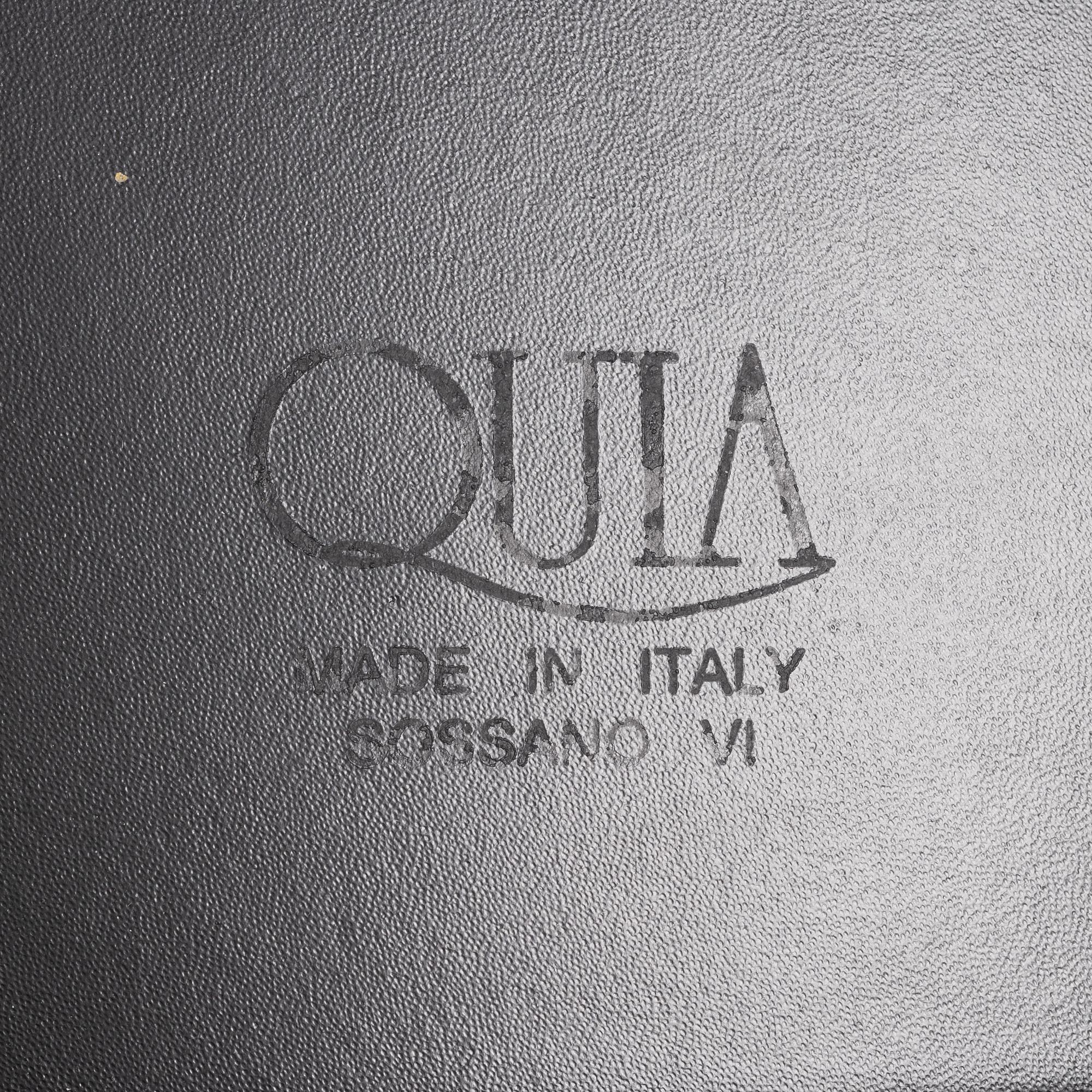 Twelve black leather 'Sossano' chairs, Quia, Italy.