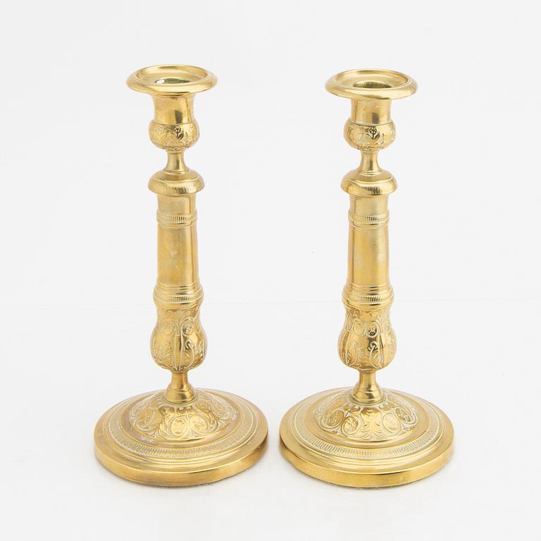 A pair of 19th century brass candle sticks.
