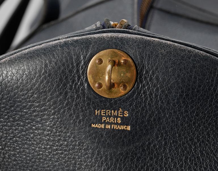 A 1970s blue leather weekendbag by Hermès.