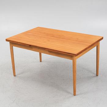 Hans J. Wegner, an oak and teak dinner table for Andreas Tuck. Denmark.