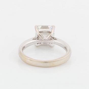 An 18K white gold ring set with an Asscher-cut diamond.