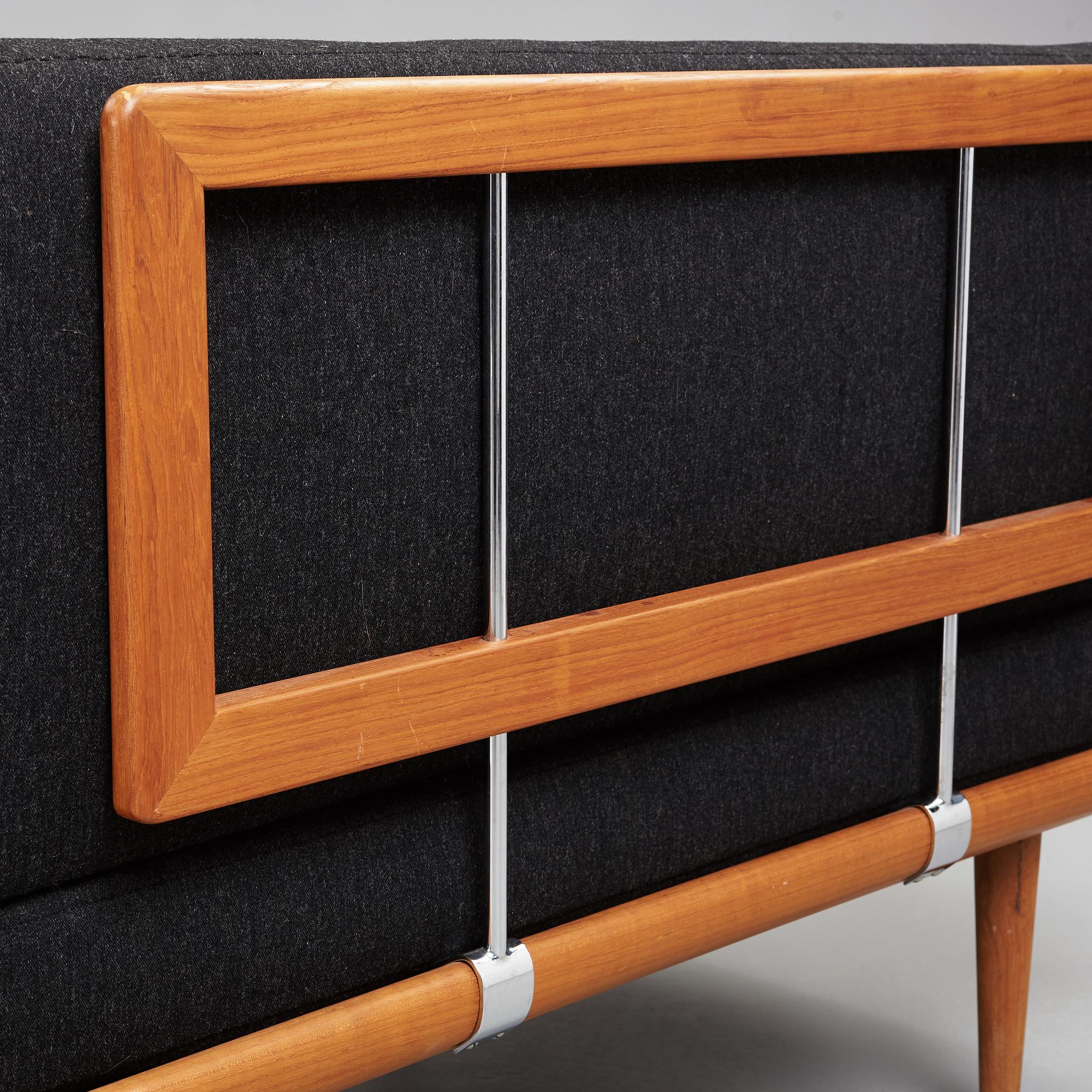 A set of two Danish 'Minerva' sofas with a table for France & Daverkosen.