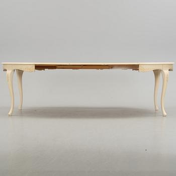 A mid 20th century rococo style dining table.
