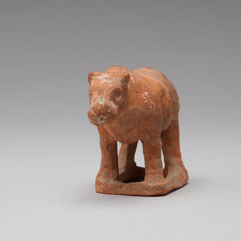 Three pottery scultpures of animals and a herdsman, Tang dynasty (618-906).