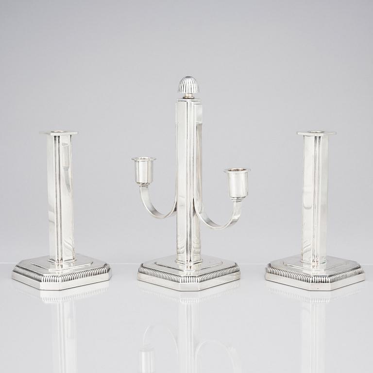 W.A. Bolin, a pair of silver candlesticks and a candelabrum, Stockholm 1953.