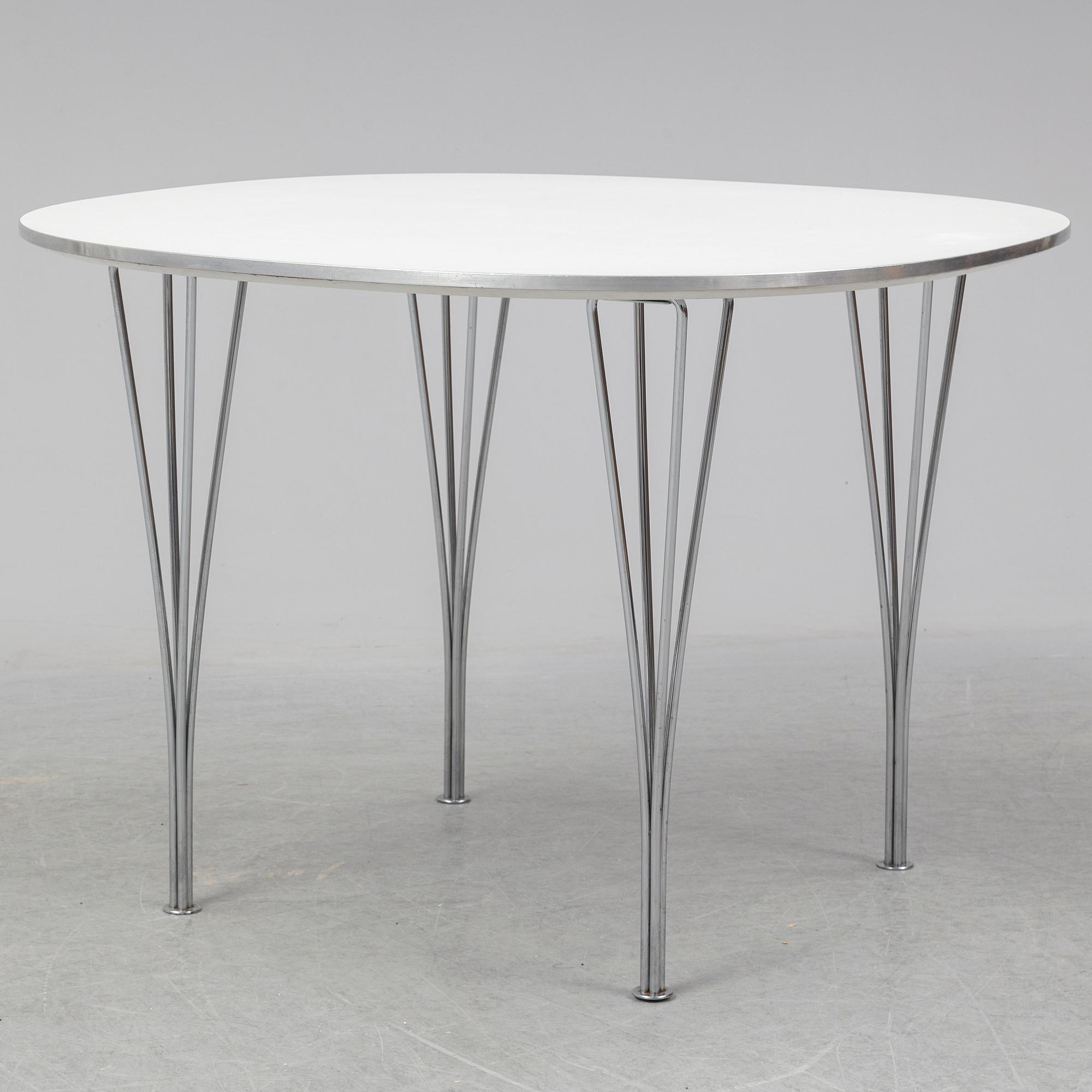 A table by Bruno Mathsson and Piet Hein for Fritz Hansen dated 1990.