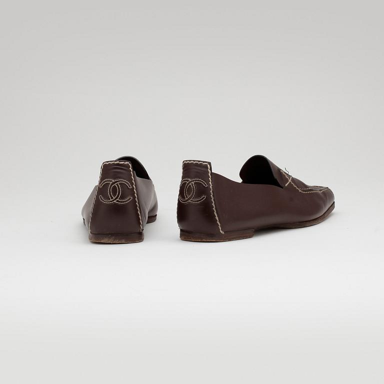 Chanel, CHANEL, a pair of brown leather loafers.