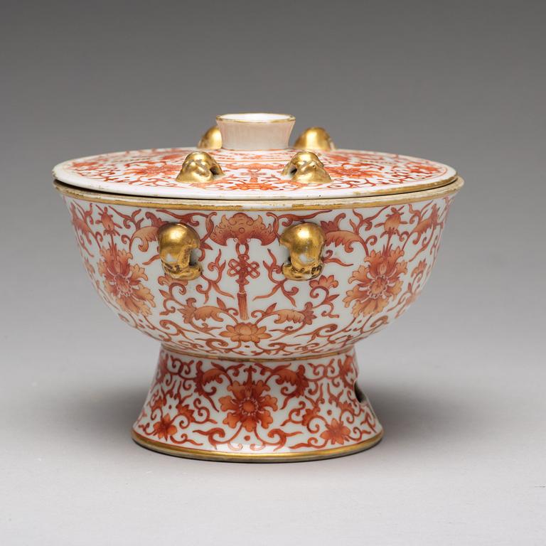 A iron red decorated bowl with cover, Qing dynasty with Daoguang mark in red.