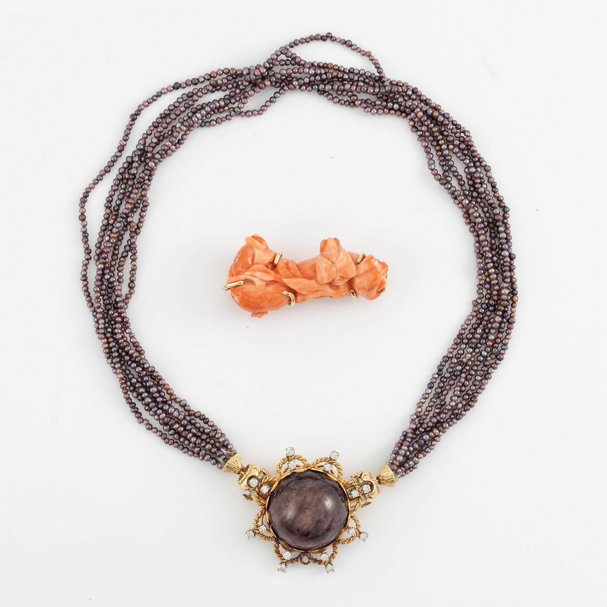 Multi-strand pearl necklace with two clasps set with carved coral, cabochon-cut tourmaline, and brilliant-cut diamonds.