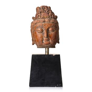 1099. A large sculpture head of Guanyin, Ming dynasty (1368-1644).