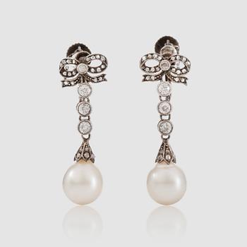 1436. A pair of diamond, circa 0.70 ct, and probably cultured pearl earrings. Stockholm 1910.