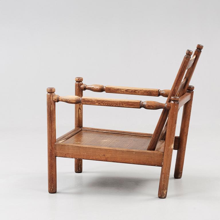 An Axel Einar Hjorth stained pine 'Sandhamn' armchair, Nordiska Kompaniet 1929.