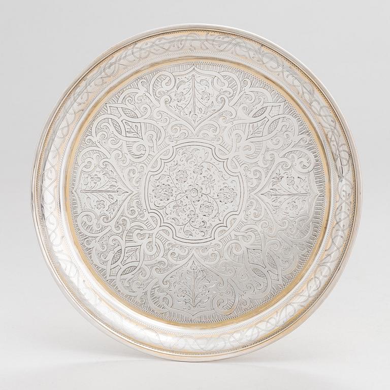 A parcel-gilt silver tray, Moscow 1856.