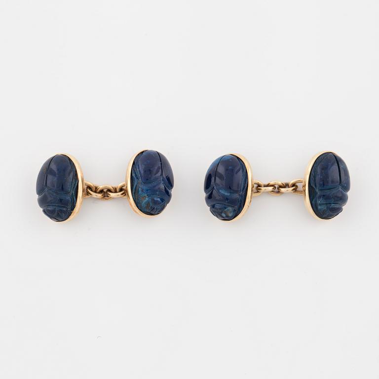 A pair of carved lapis lazuli cufflinks.