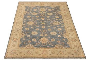 An Ushak rug, c. 242 x 165 cm.
