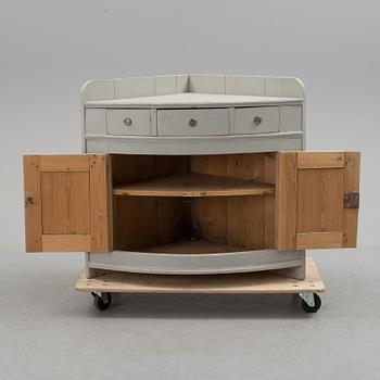 A mid 19th century corner sideboard.