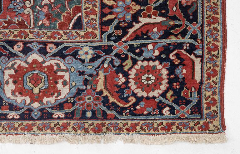 An Antique Heriz carpet, North west persia, c. 380 x 310 cm.