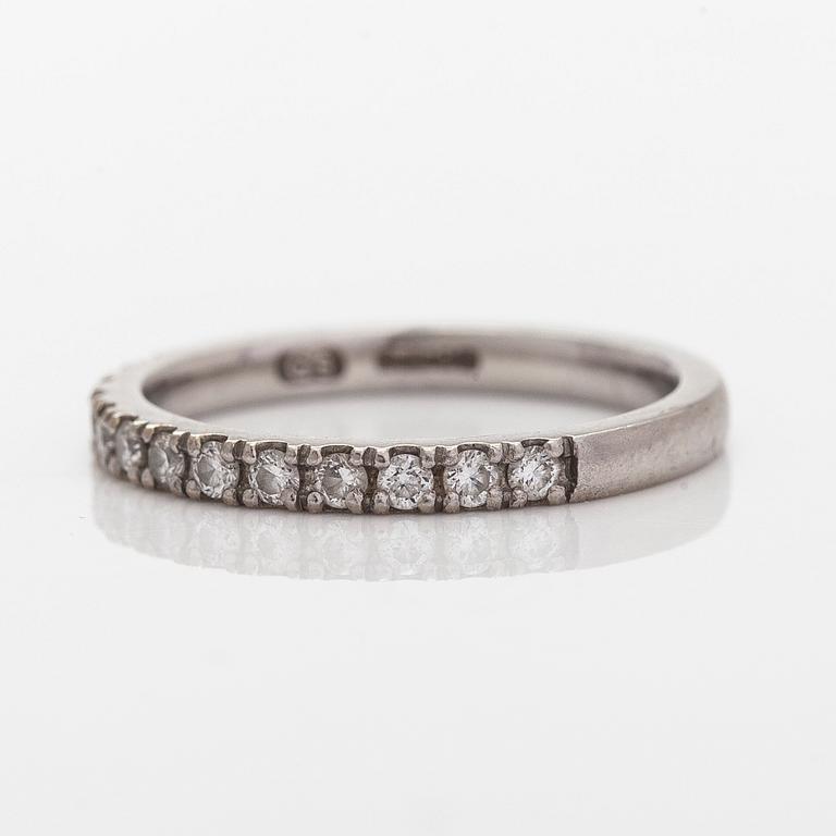 A platinum ring with brilliant cut diamonds.