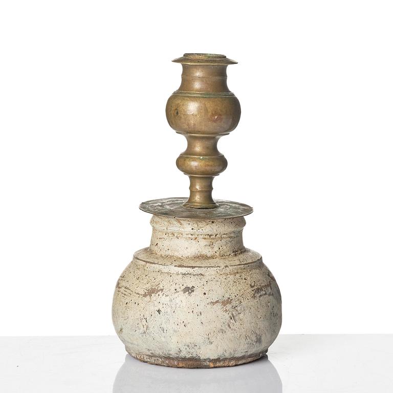 A Northern European baroque candlesticks, late 17th century, with a repaired wooden base.