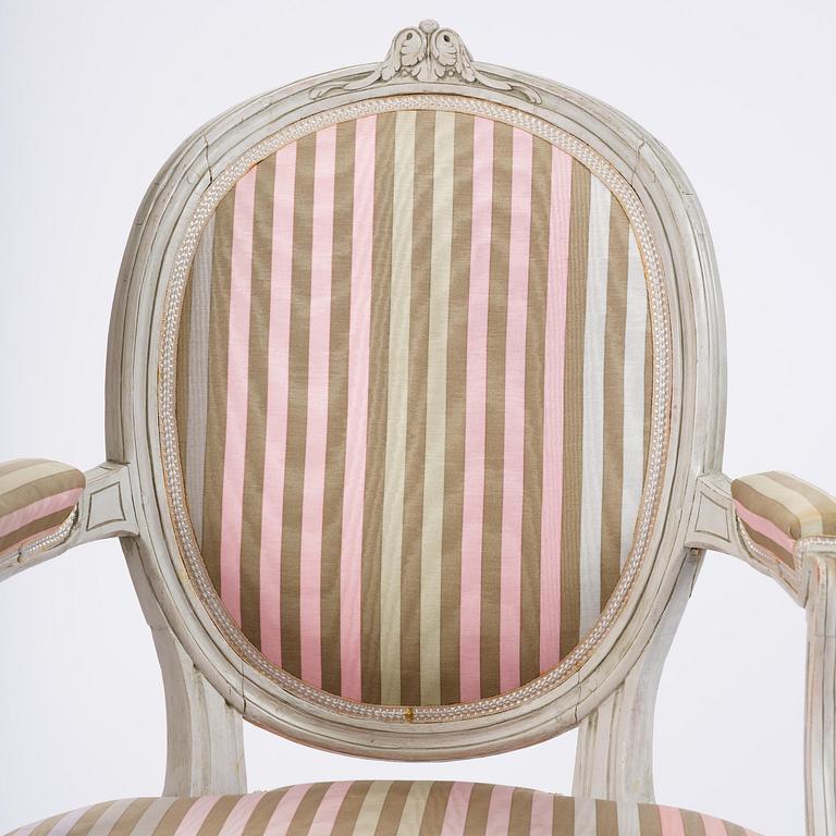 A pair of Gustavian open armchairs by E. Öhrmark (master in Stockholm 1777-1813).