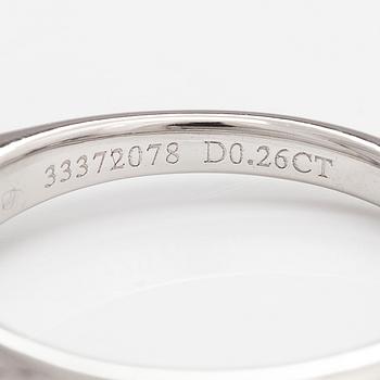 Tiffany & Co, A platinum ring with a ca. 0.26 ct diamond.