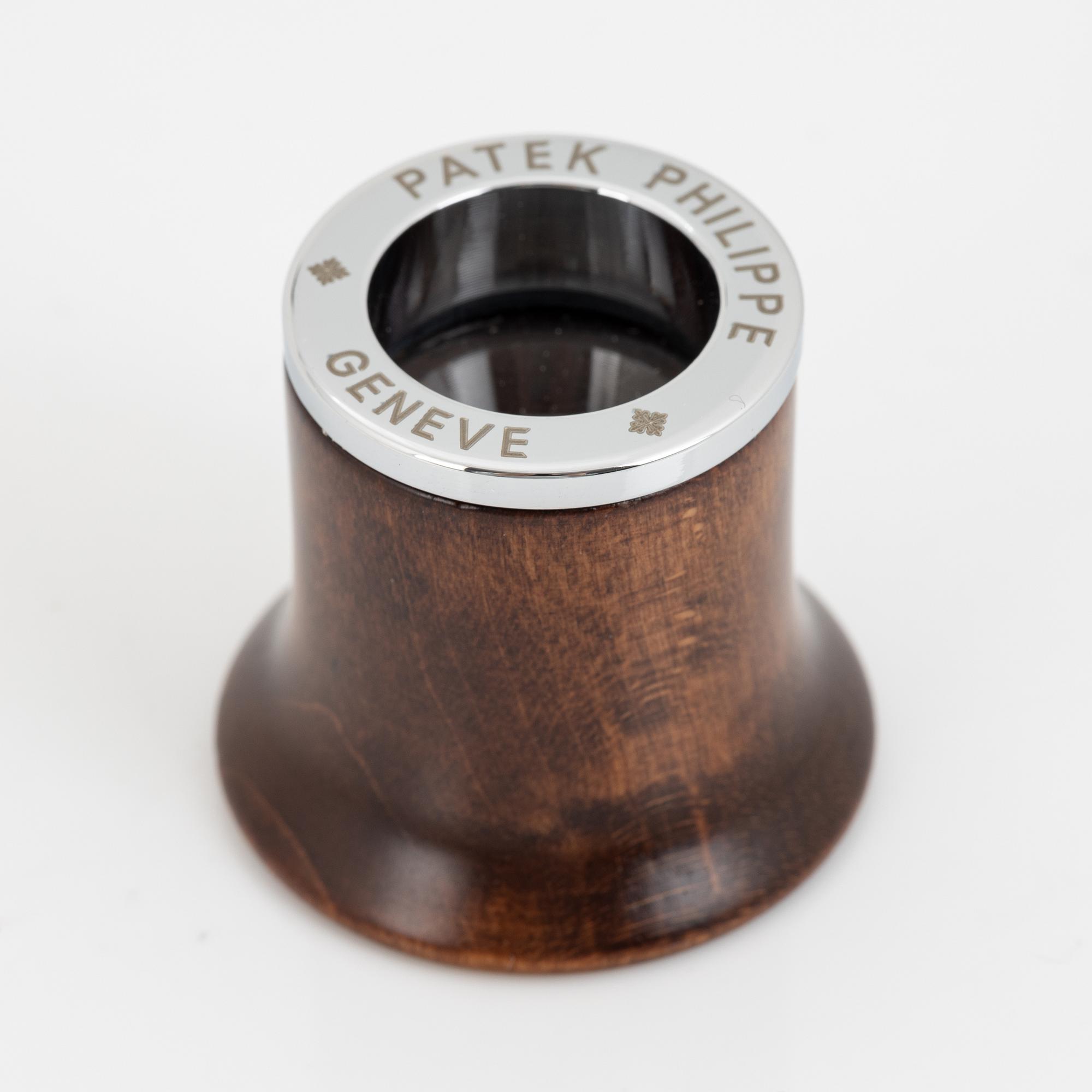 Patek Philippe, loupe, gloves.