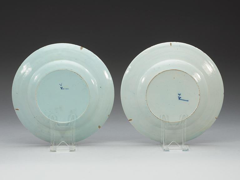 A pair of Delft faience topographical dinner plates, 18th Century.