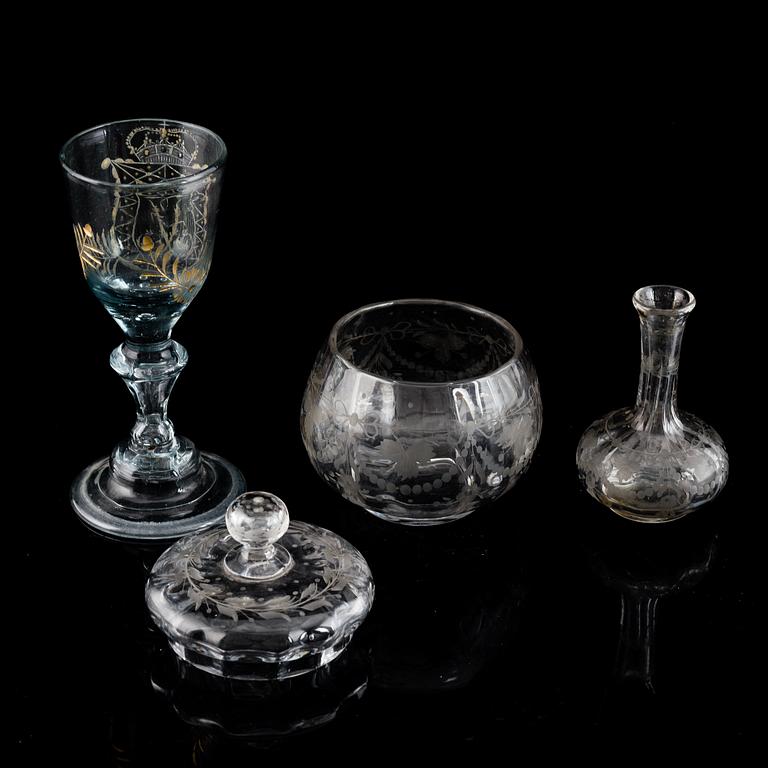 GLASS ITEMS, 3 pieces. Wineglass, 18th Century, a glass bowl with lid and a minature vase. All engraved.