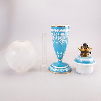 A glass paraffin lamp around 1900.