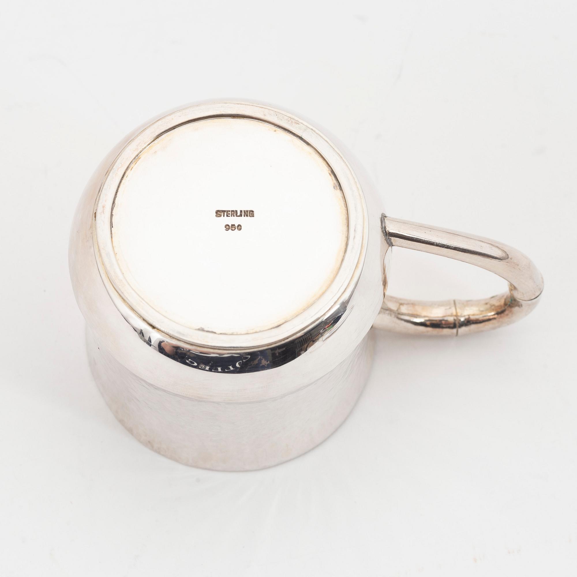 Six parcel-gilt sterling silver jugs.