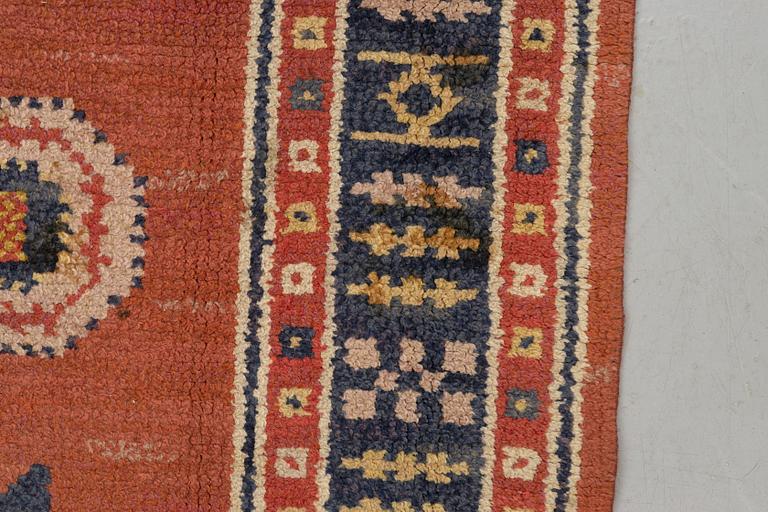Märta Måås-Fjetterström, a carpet, "Röd Flossa", knotted pile, ca 300 x 272 cm, signed AB MMF.