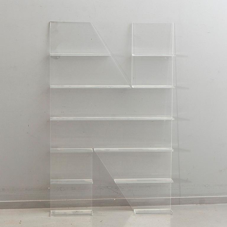 Shelf, plexi glass, in the shape of the letter 'N', Non Violence.