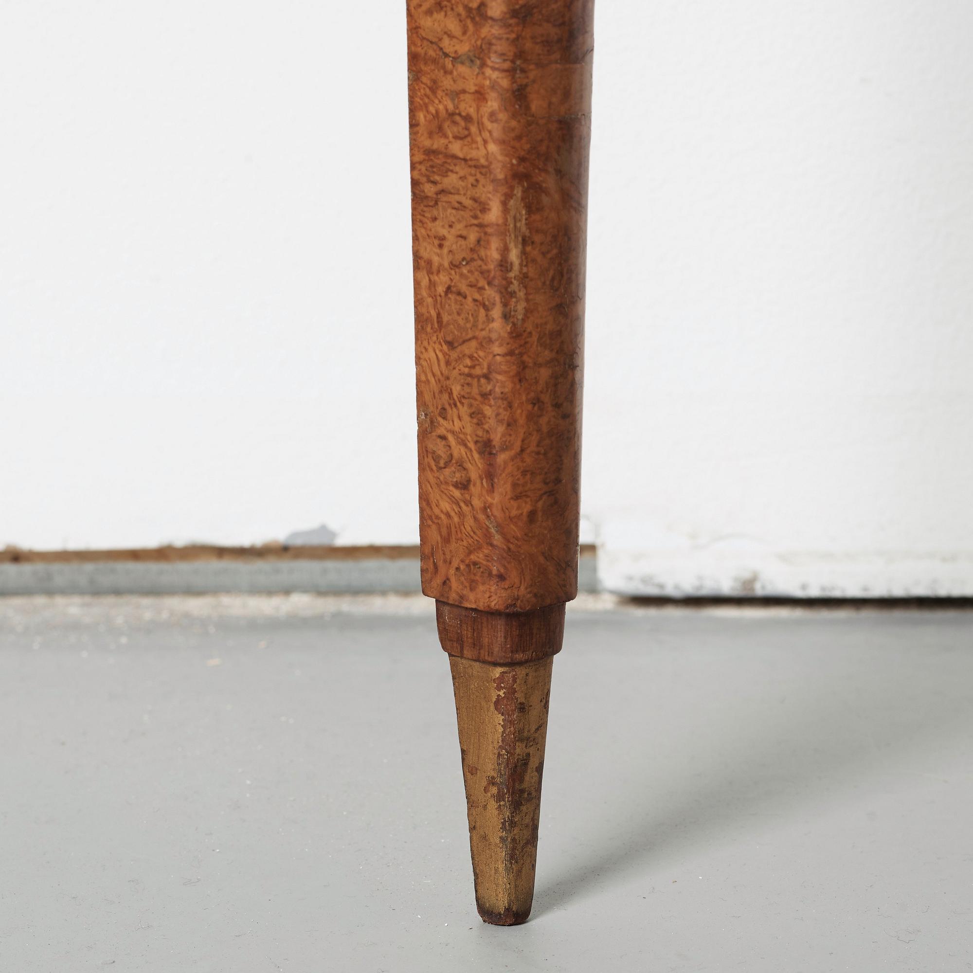 A pair of French Art Déco demi-lune console tables in the manner of Paul Follot, France 1920-30.