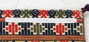 A double-interlocked tapestry carrige cushion, c 100 x 50 cm, Scania, mid 19th century.