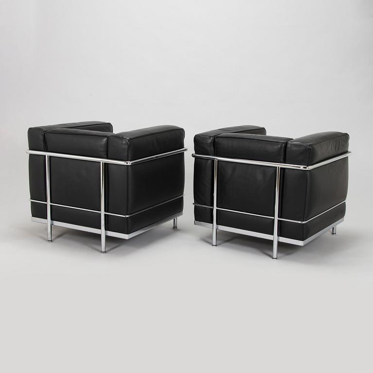 Pierre Jeanneret, Charlotte Perriand & Le Corbusier, a pair of 'LC2' armchairs, Cassina, Italy.