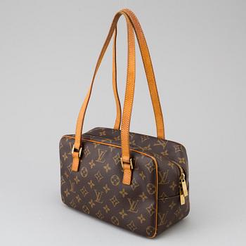 a LOUIS VUITTON ' Cite' bag.