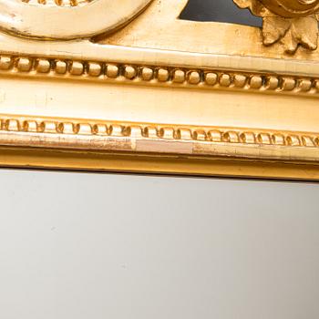 A Gustavian mirror signed Johan Åkerblad (master in Stockholm 1758 - 1799), dated 1785.