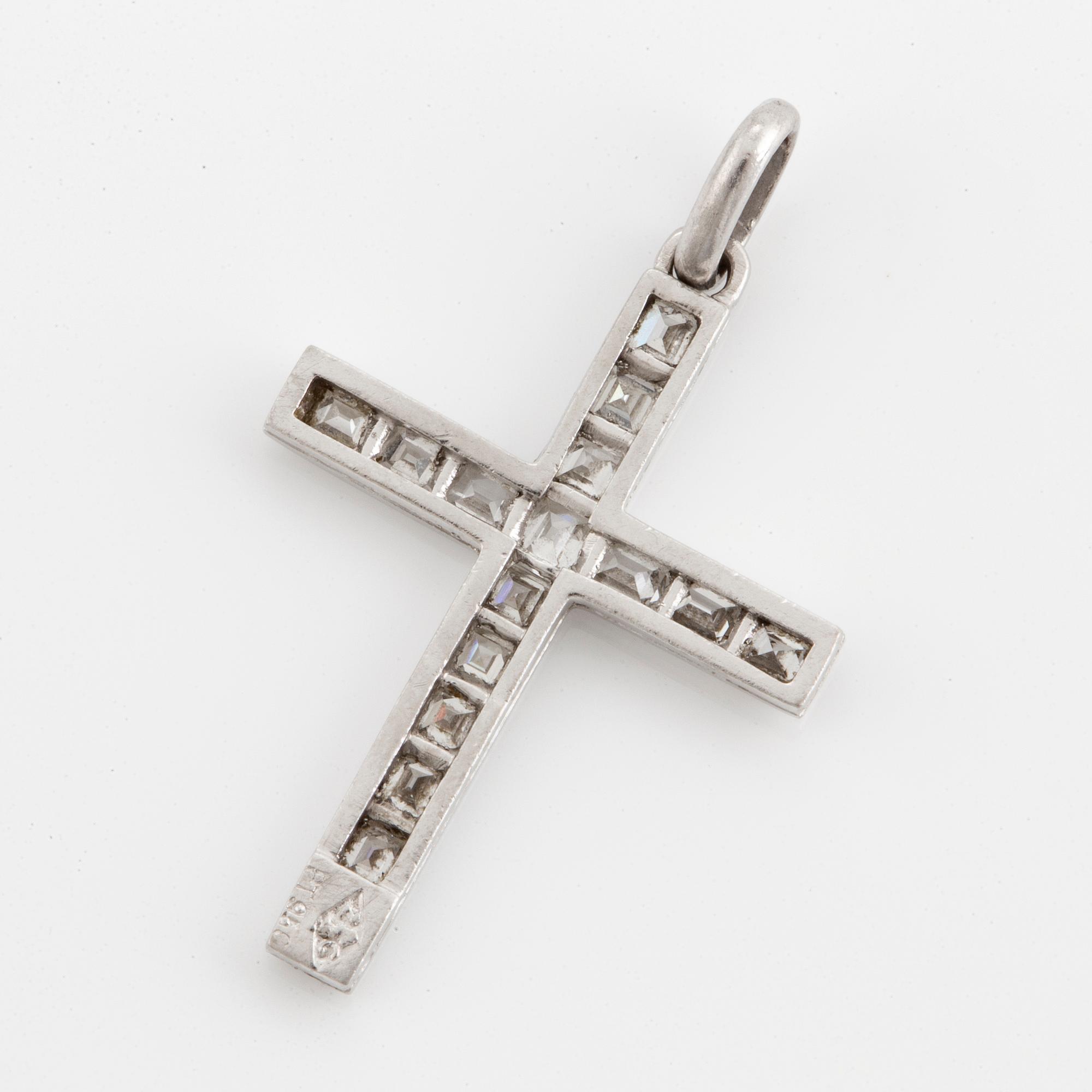 Platinum cross with step-cut diamonds.