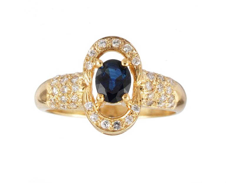 RING, set with blue sapphire and diamonds.