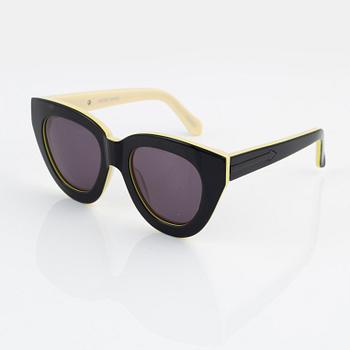 Karen Walker, a pair of "Anytime" sunglasses.