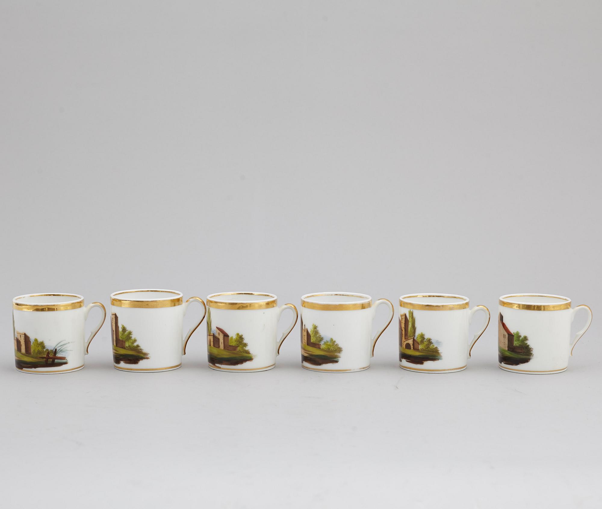A group of seven cups, one with dish, Germany and France, 19th century.