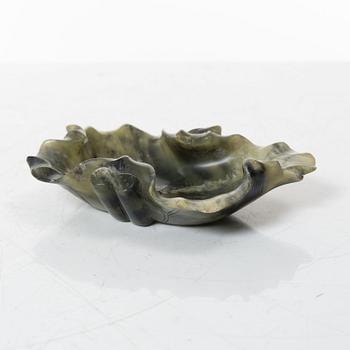 A Chinese green stone brush washer, a carved bone and a soapstone figure, partly Qing dynasty.