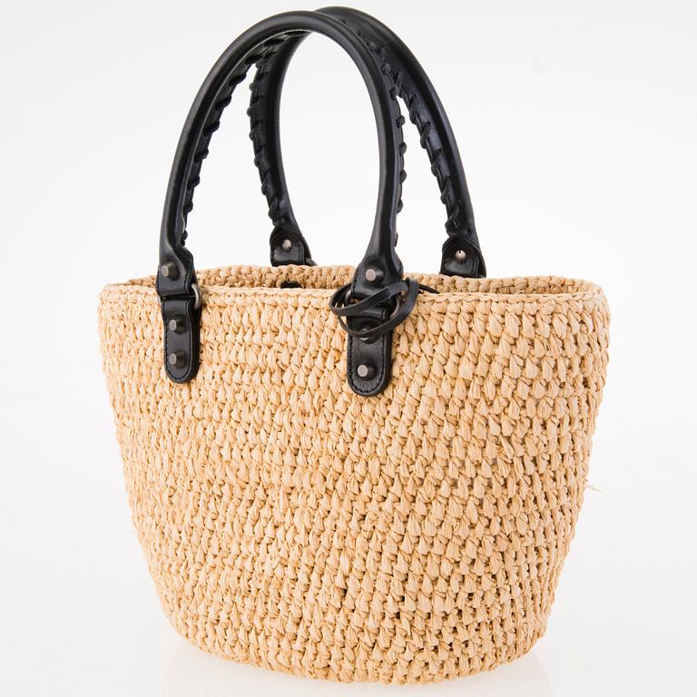 BALENCIAGA Panier leather-trimmed woven raffia tote with a silk scarf.