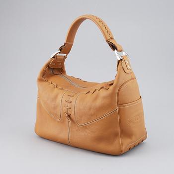 TOD'S, a tan leather bag.
