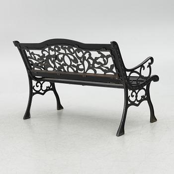 A garden bench, late 20th century.