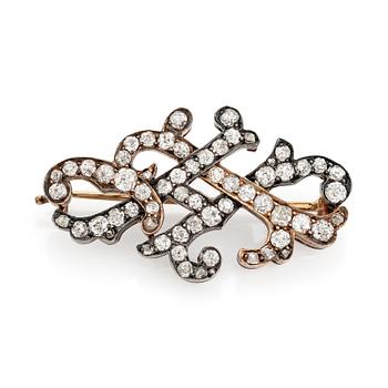 587. A gold and silver brooch set with old- and rose-cut diamonds.